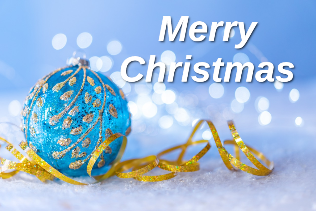 a beautiful blue ornament with the words Merry Christmas